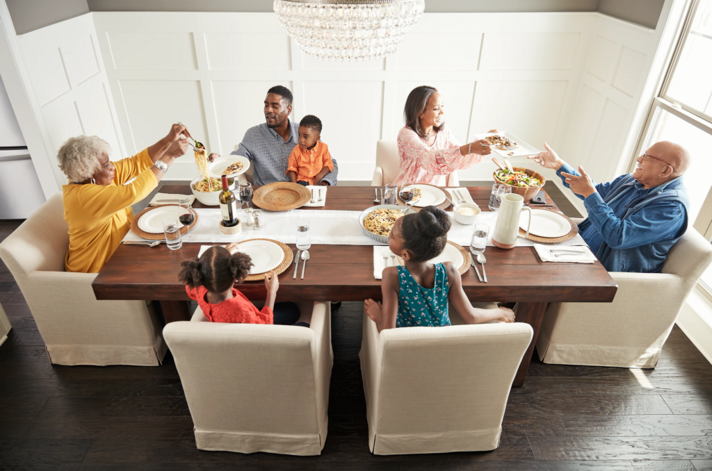 Family having breakfast at the dining table | McCool's Flooring