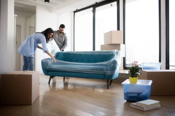 Couple moving sofa | McCools Flooring