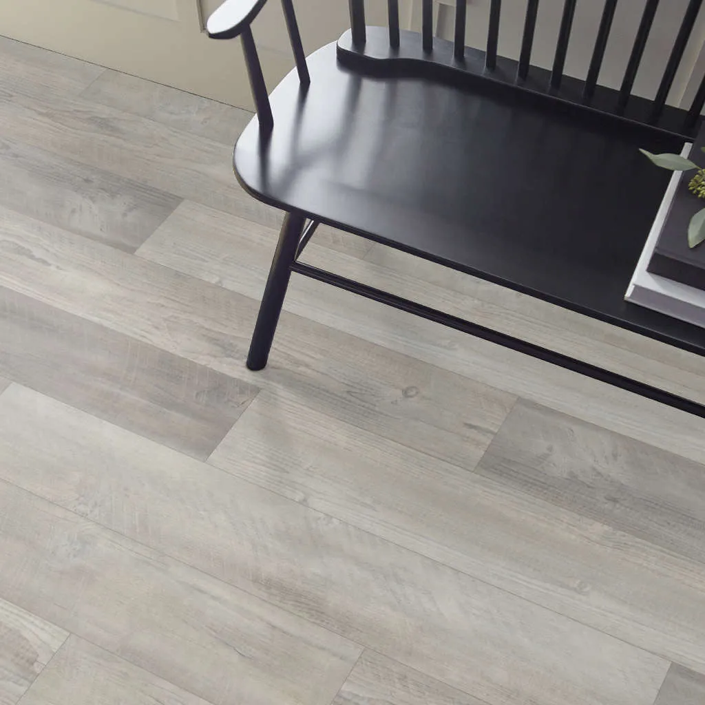 Black sofa on floor | McCool's Flooring