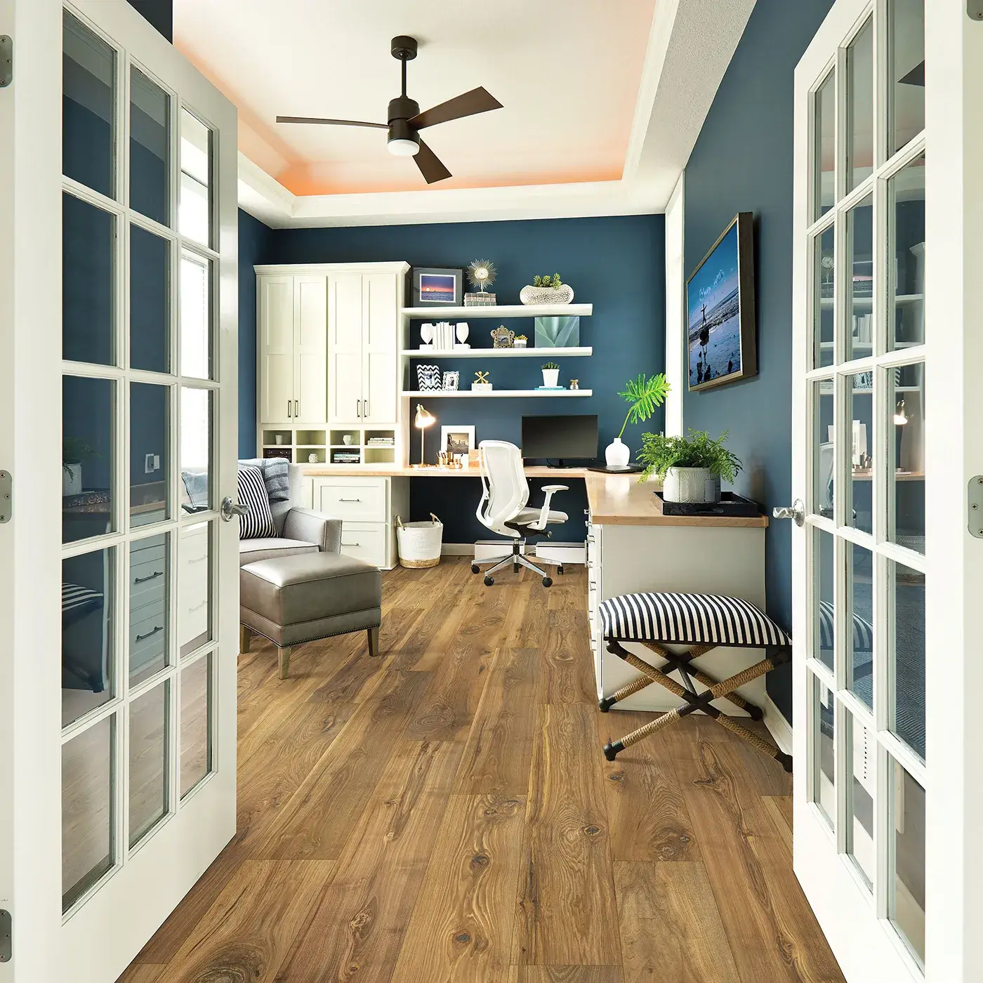 33607_03_room Laminate in a medium brown wood tone in a home office | McCool's Flooring