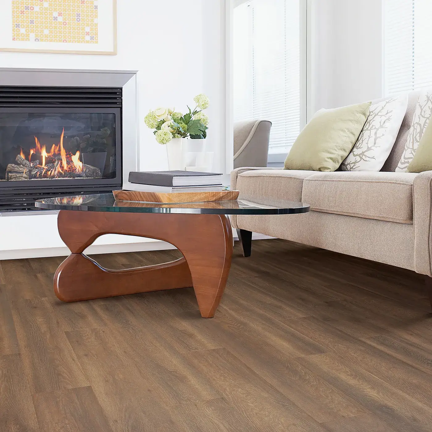 33609_04_room Laminate in a medium brown wood tone in a living room with a fireplace | McCool's Flooring