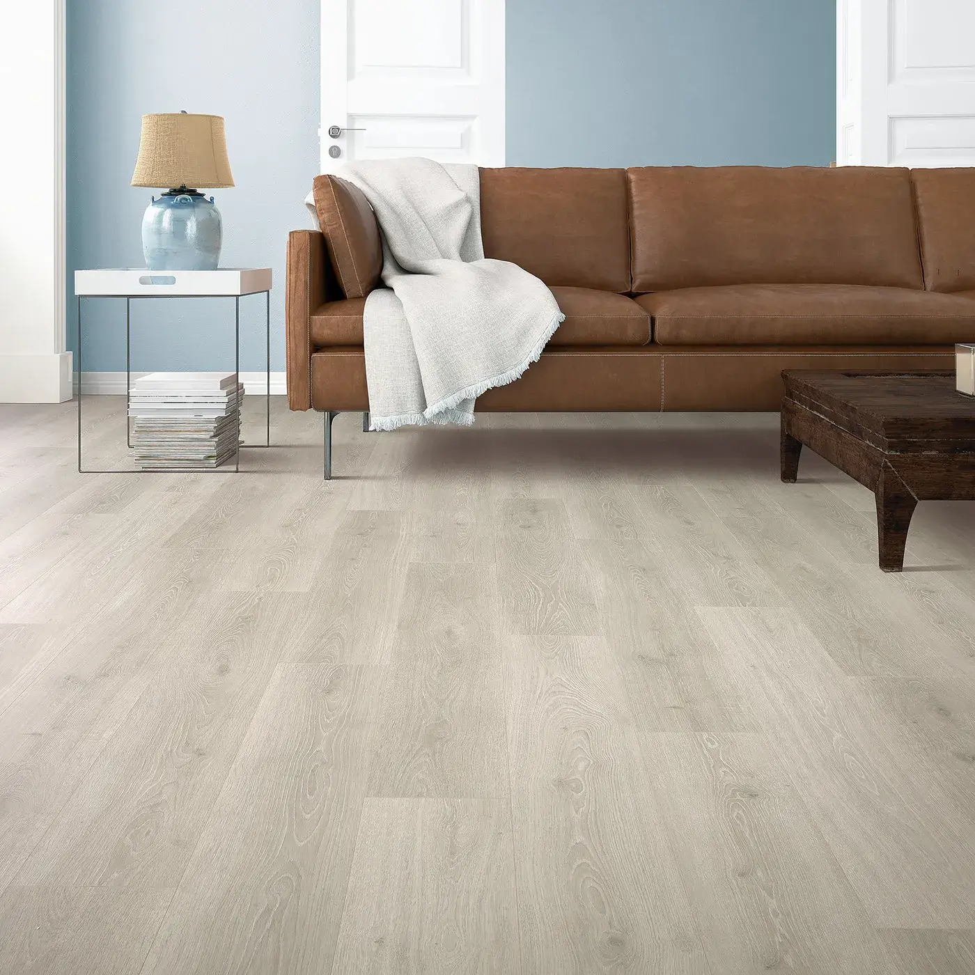 33634_03W_room Mohawk Laminate in a light, almost white wood tone in a living room | McCool's Flooring