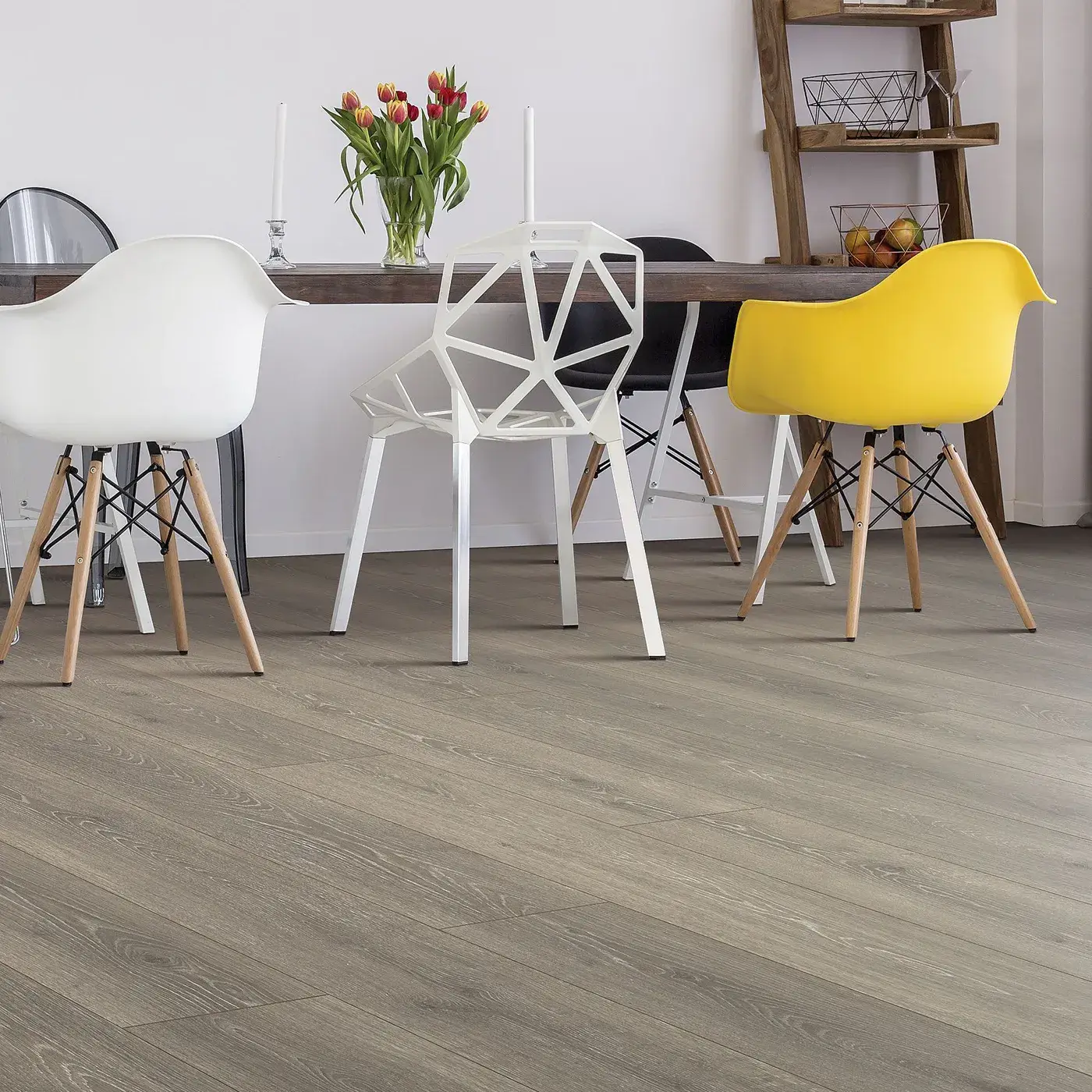 33634_06W_room Laminate in a gray-brown wood tone in a modern dining room | McCool's Flooring